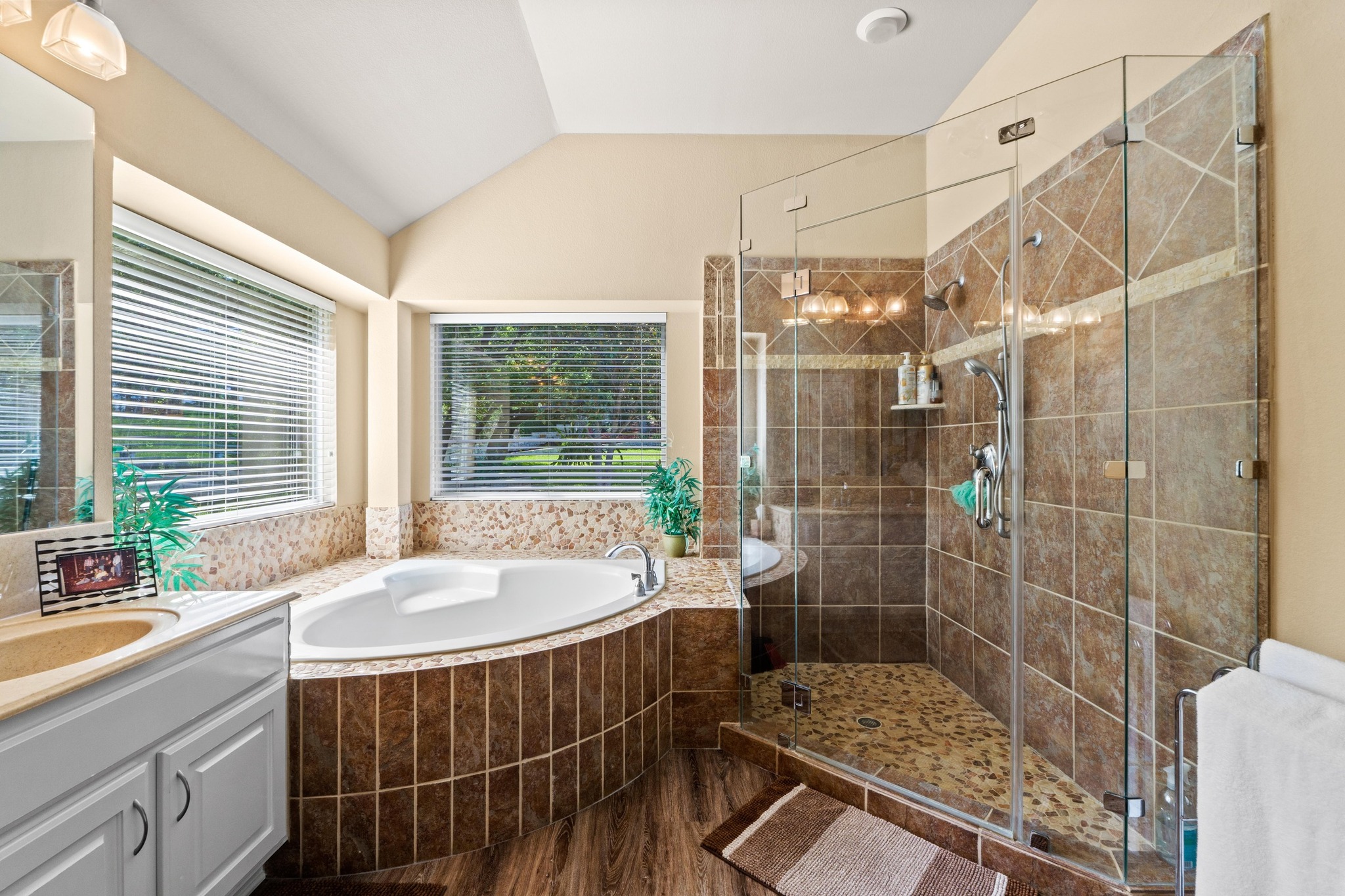 135 Tumbleweed Trail North Austin, TX 78733 - Photo 14 of 39 The primary bathroom is right next to an enormous walk-in closet. You will need to go shopping for more clothes!
