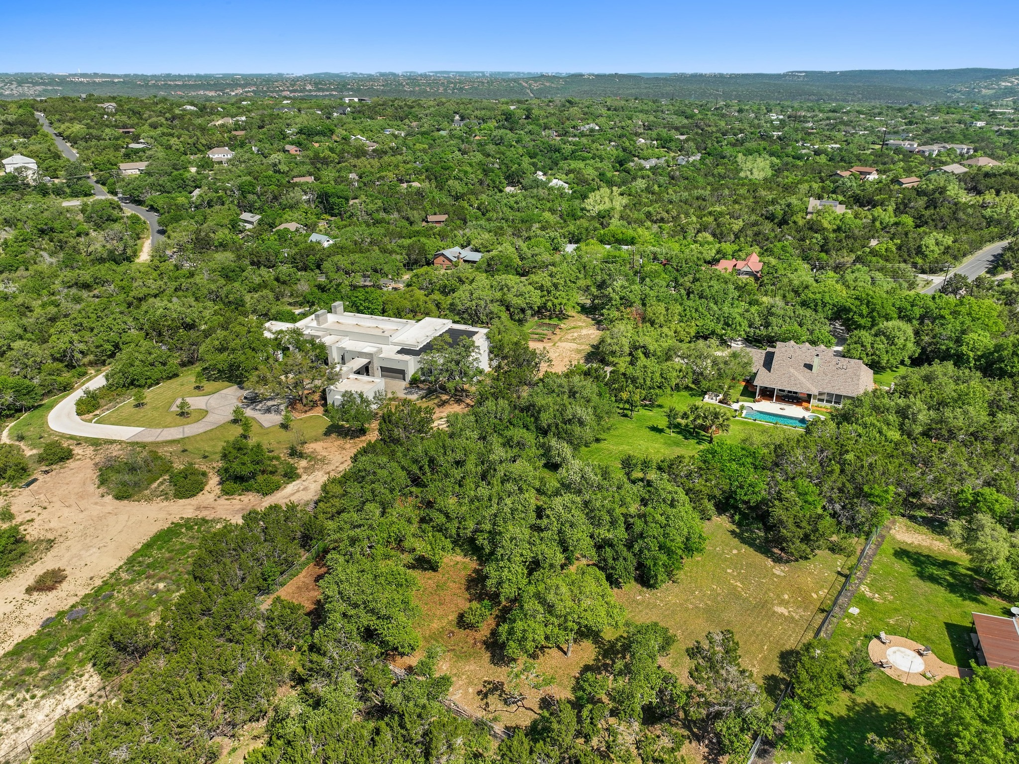 135 Tumbleweed Trail North Austin, TX 78733 - Photo 32 of 39 Drone / aerial view of a forest