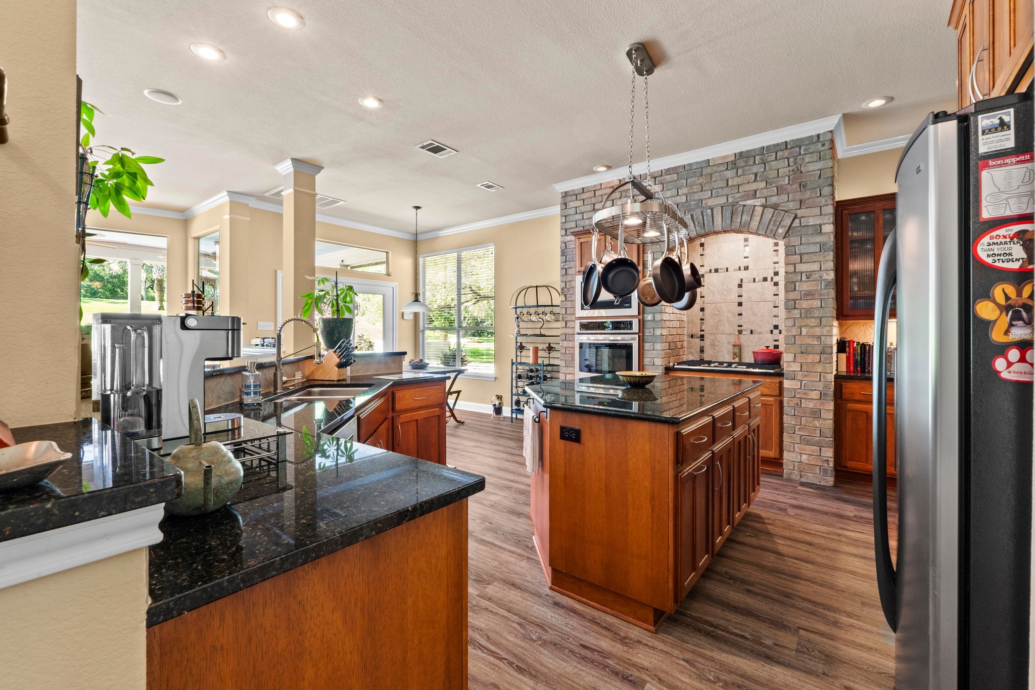 135 Tumbleweed Trail North Austin, TX 78733 - Photo 7 of 39 Pecan cabinets, built-in stainless steel appliances include a double oven, microwave, and a wine fridge.