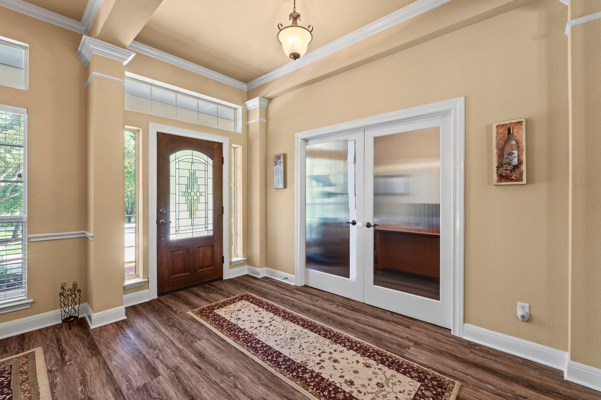 135 Tumbleweed Trail North Austin, TX 78733 - Photo 9 of 39 Foyer entrance featuring French doors to the office/study, ornamental molding, and decorative columns