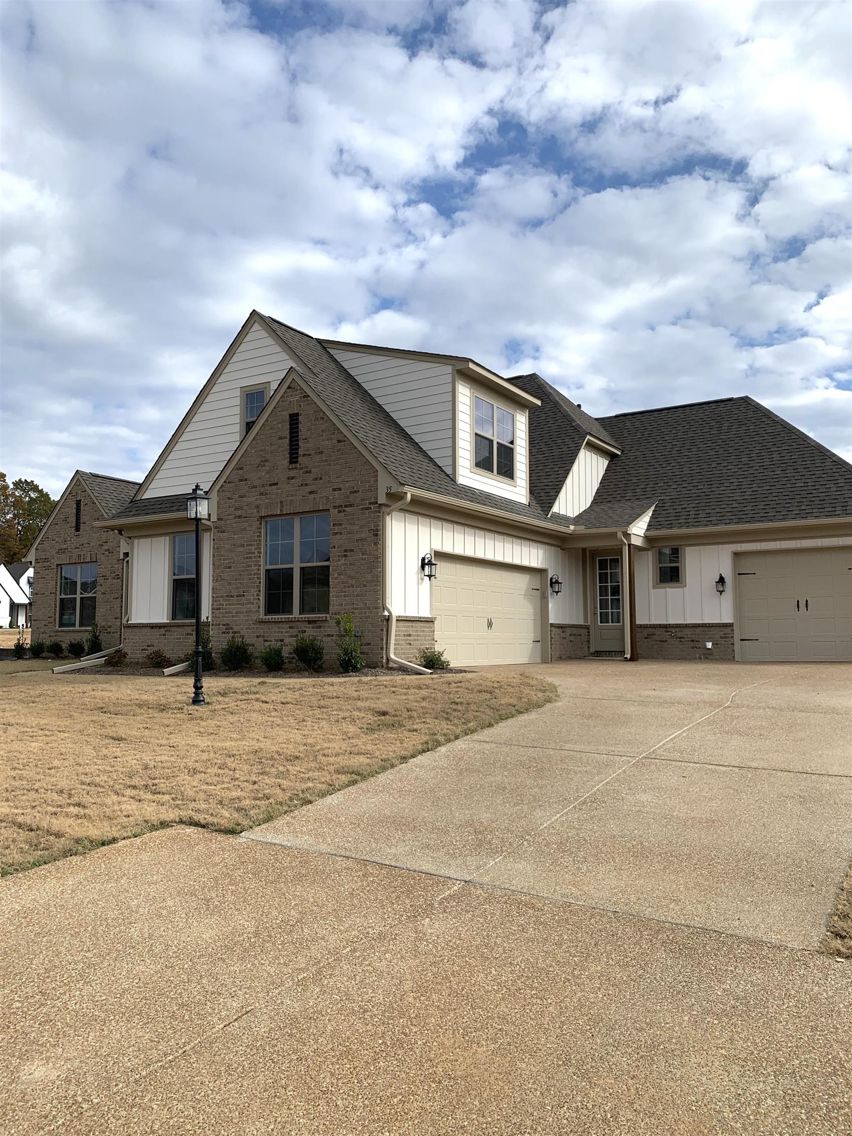 35 Grassy Hill Road Collierville, TN 38017 - Photo 2 of 33 a front view of a house with a yard and garage
