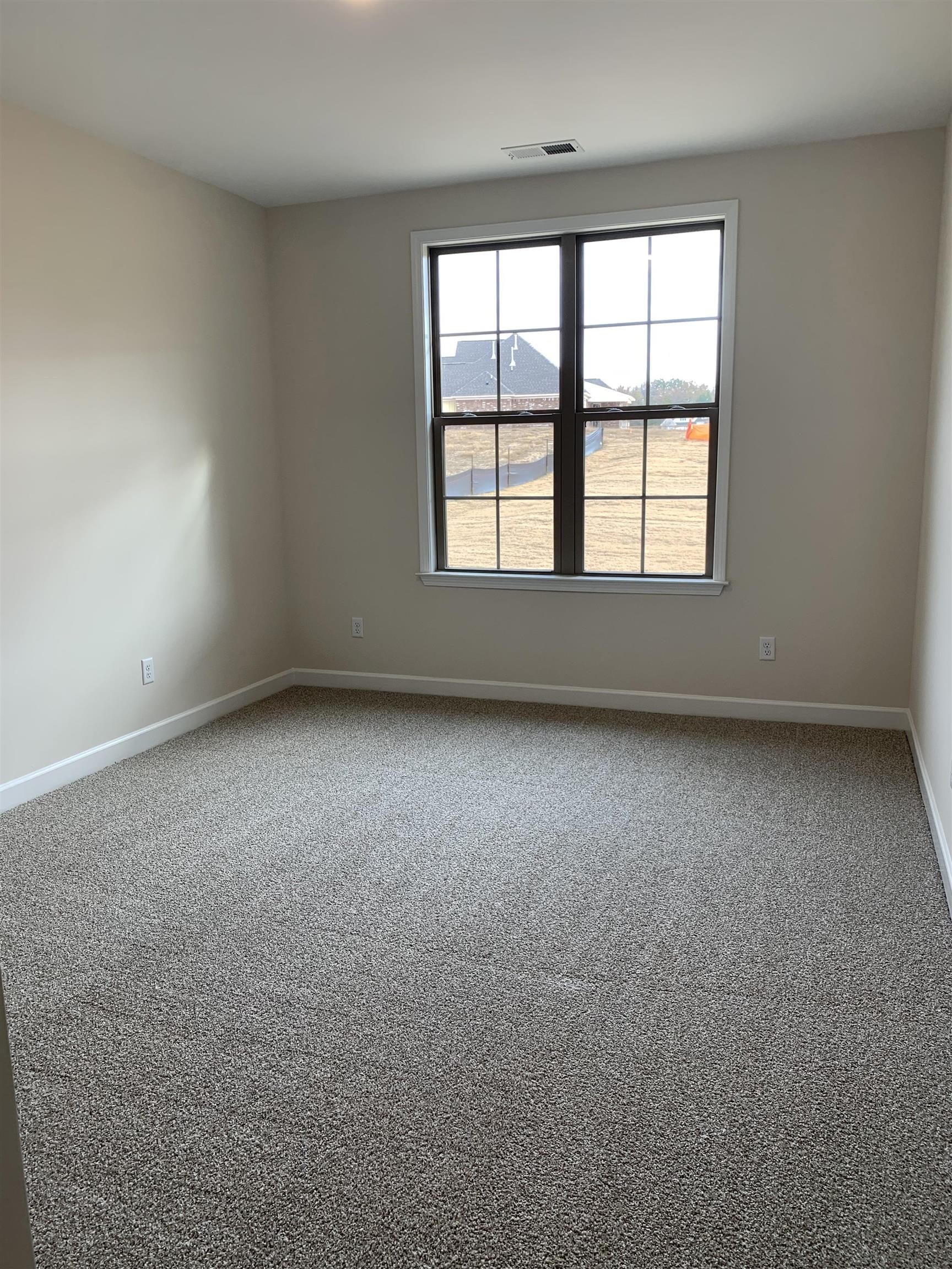 35 Grassy Hill Road Collierville, TN 38017 - Photo 22 of 33 an empty room with a window