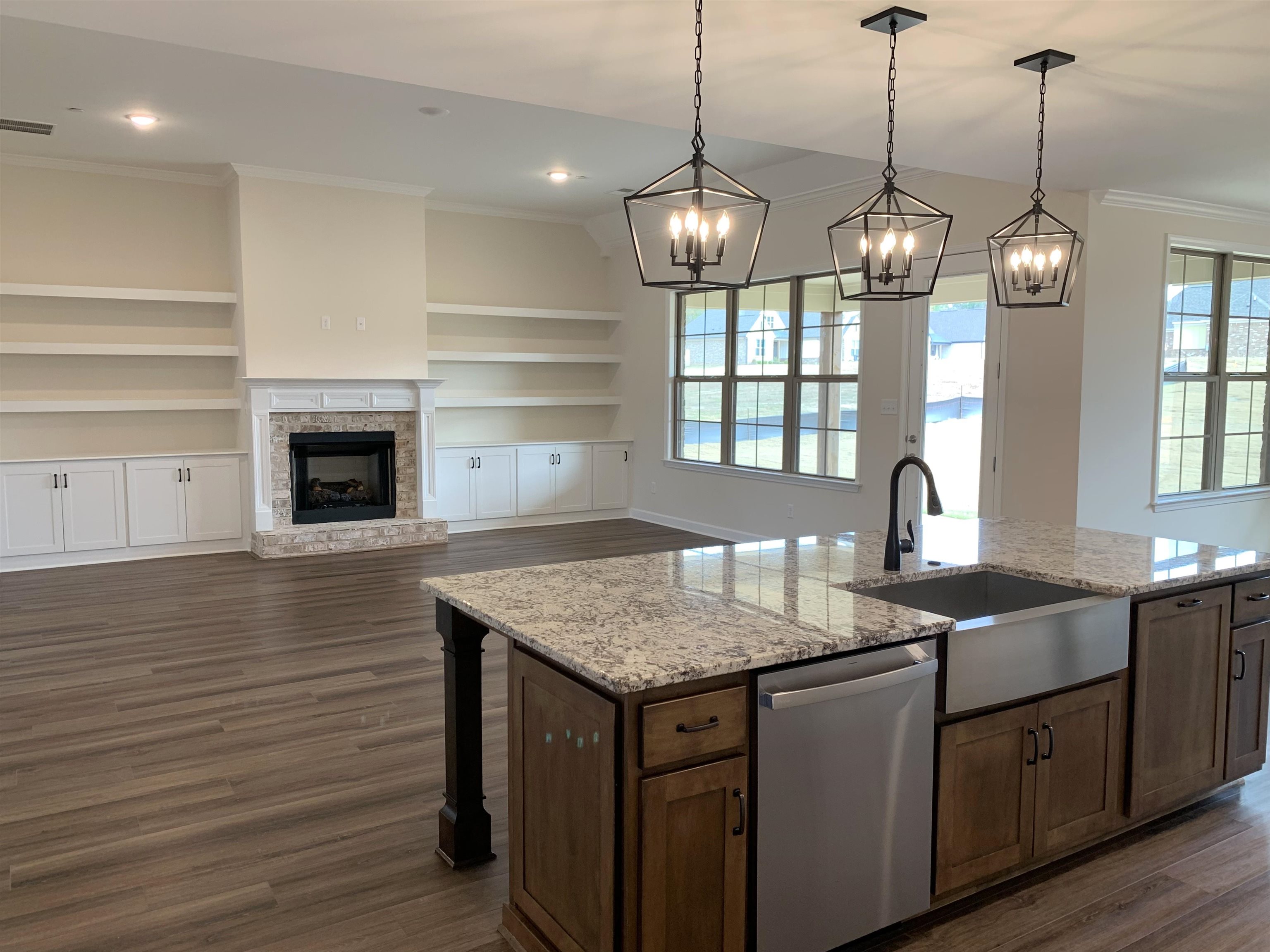 35 Grassy Hill Road Collierville, TN 38017 - Photo 8 of 33 a kitchen with granite countertop stainless steel appliances a stove cabinets and wooden floor