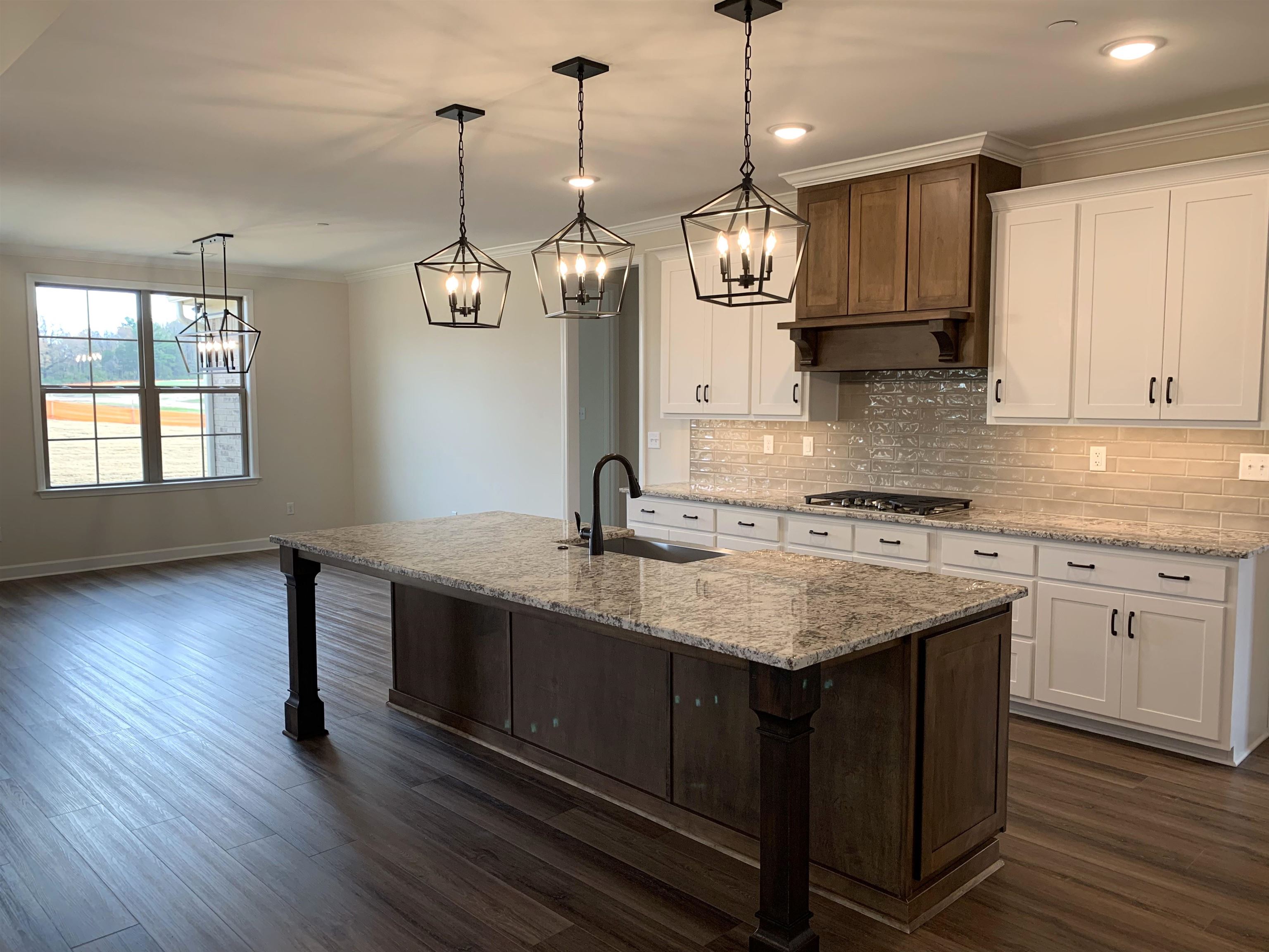 35 Grassy Hill Road Collierville, TN 38017 - Photo 9 of 33 a kitchen with granite countertop a sink cabinets and wooden floor