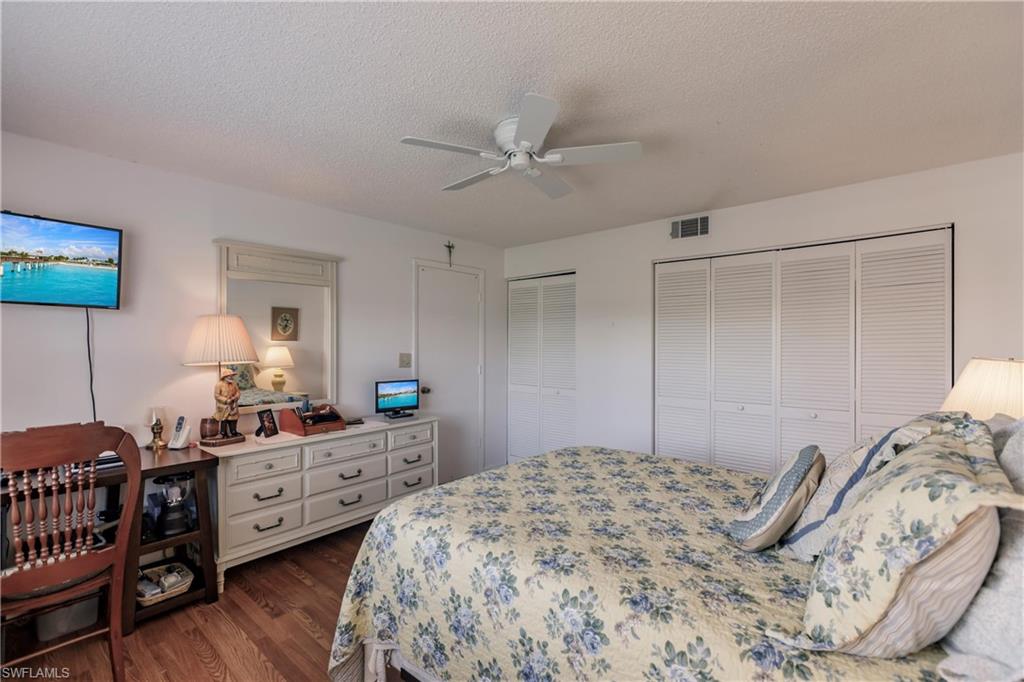 550 Teryl Road, Unit 2301 Naples, FL 34112 - Photo 19 of 31 a bedroom with a bed and a desk