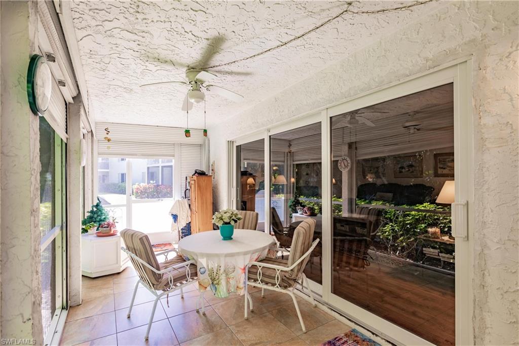 550 Teryl Road, Unit 2301 Naples, FL 34112 - Photo 23 of 31 a dining room with furniture and a potted plant