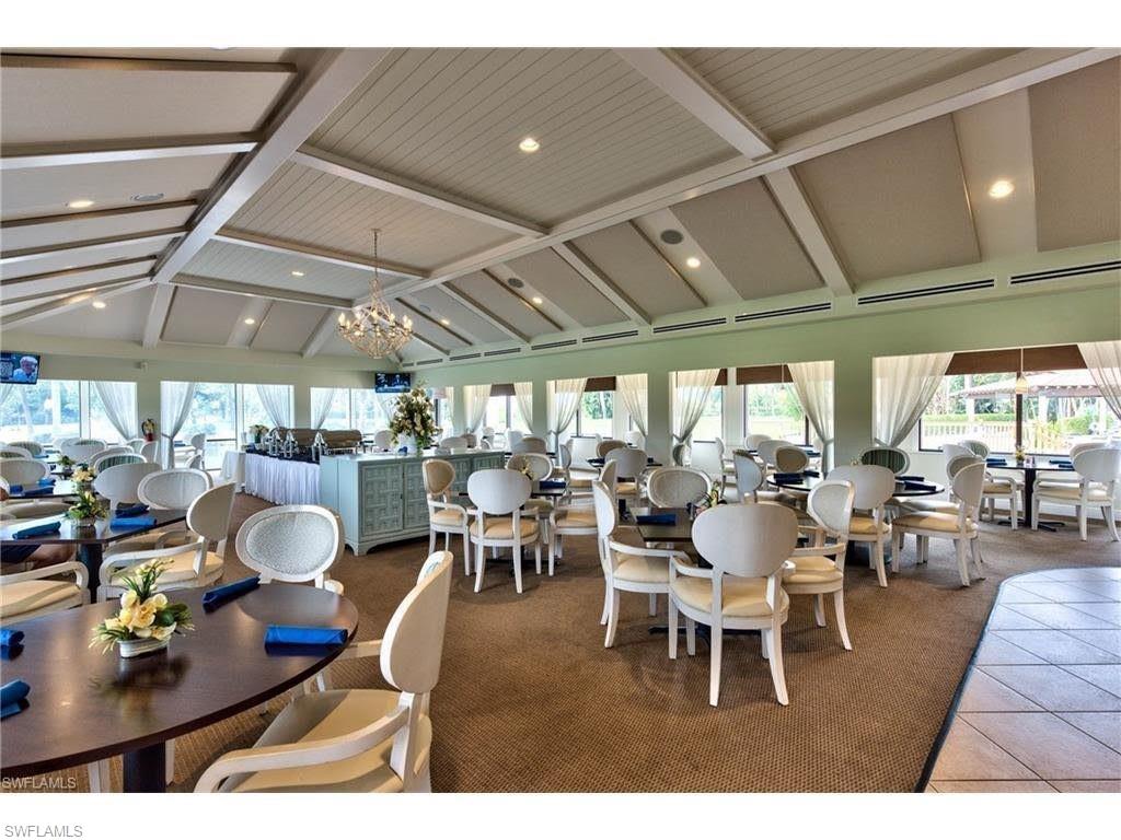 550 Teryl Road, Unit 2301 Naples, FL 34112 - Photo 29 of 31 a outdoor space with lots of tables a large window and chairs