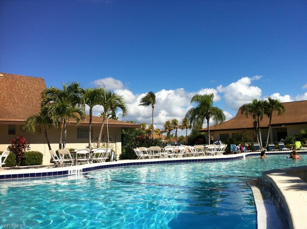 550 Teryl Road, Unit 2301 Naples, FL 34112 - Photo 31 of 31 a view of swimming pool with outdoor seating and city view