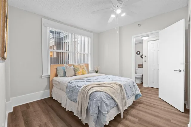 a bed room with a bed and a window