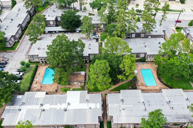 an aerial view of house with yard