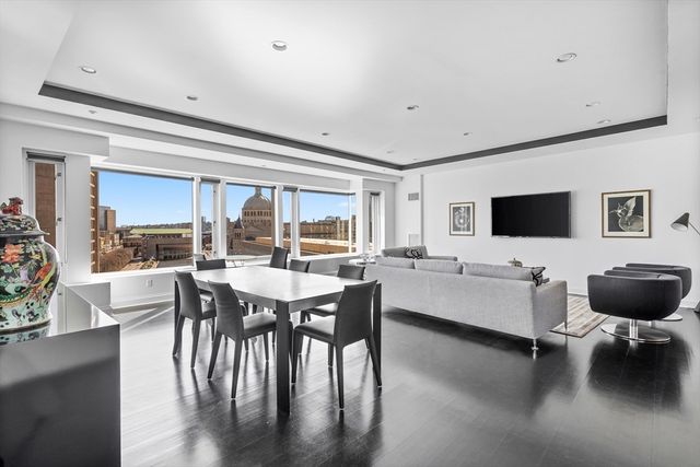 a view of a dining room with furniture and window