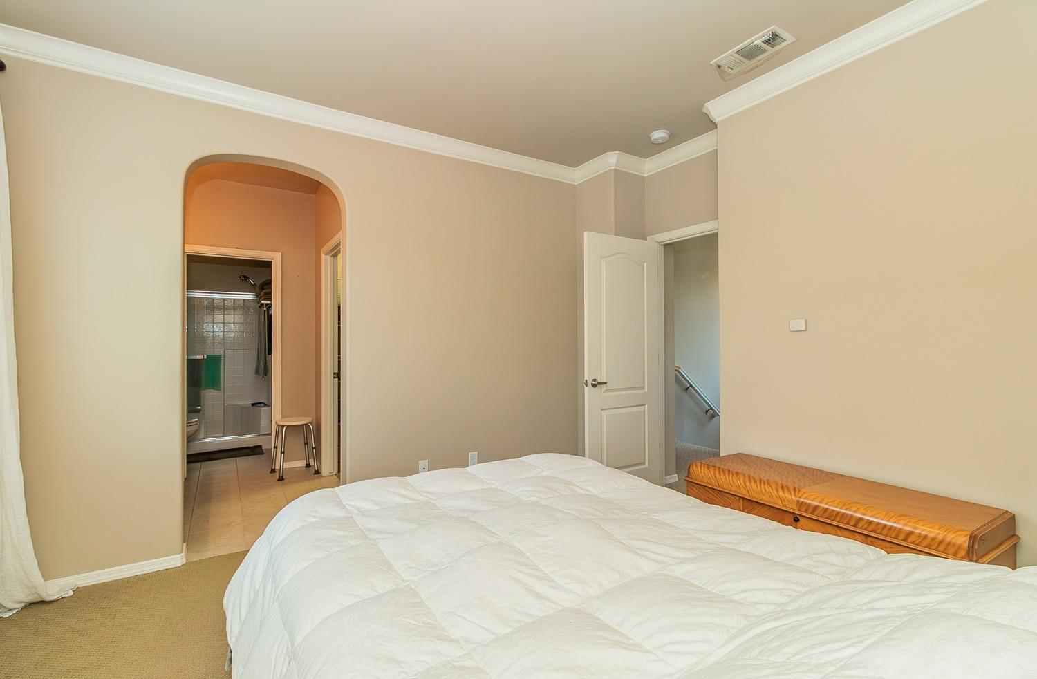 4179 Harlan Ranch Boulevard Clovis, CA 93619 - Photo 20 of 47 a bedroom with a bed and a mirror