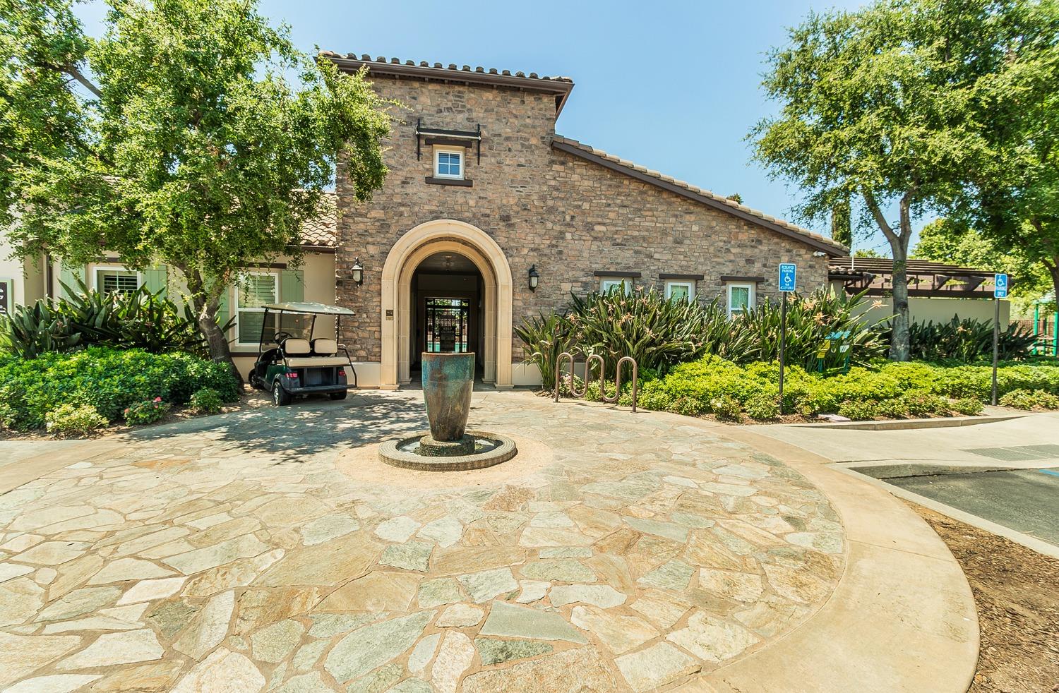 4179 Harlan Ranch Boulevard Clovis, CA 93619 - Photo 29 of 47 a front view of a house with a yard