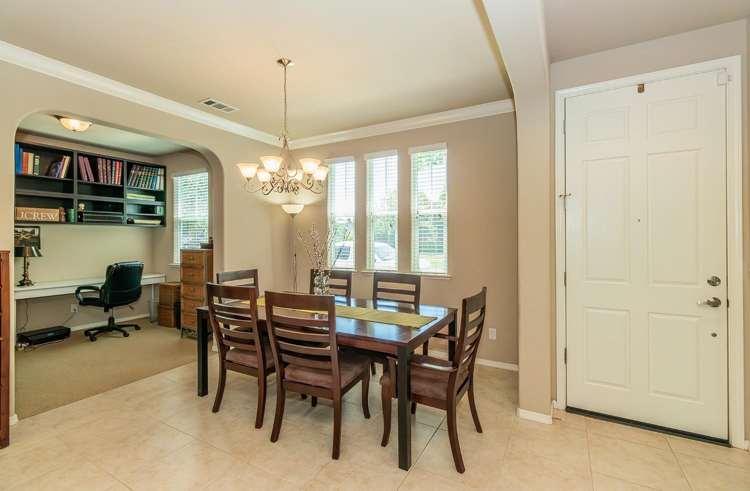 4179 Harlan Ranch Boulevard Clovis, CA 93619 - Photo 7 of 47 a view of a dining room with furniture window and outside view