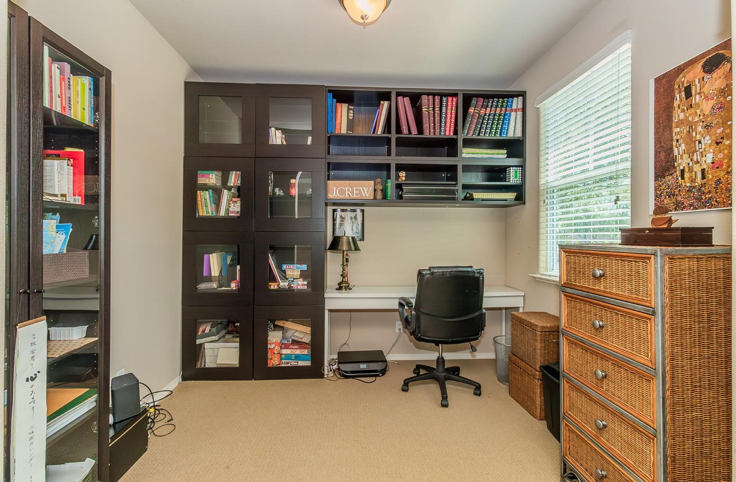 4179 Harlan Ranch Boulevard Clovis, CA 93619 - Photo 8 of 47 a view of a workspace with furniture and a window