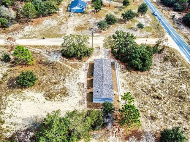a backyard of a building with large trees