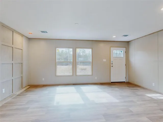 an empty room with windows