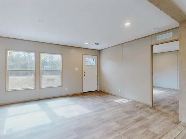 an empty room with windows