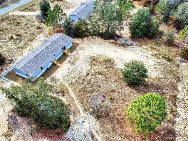 a view of a backyard of a house