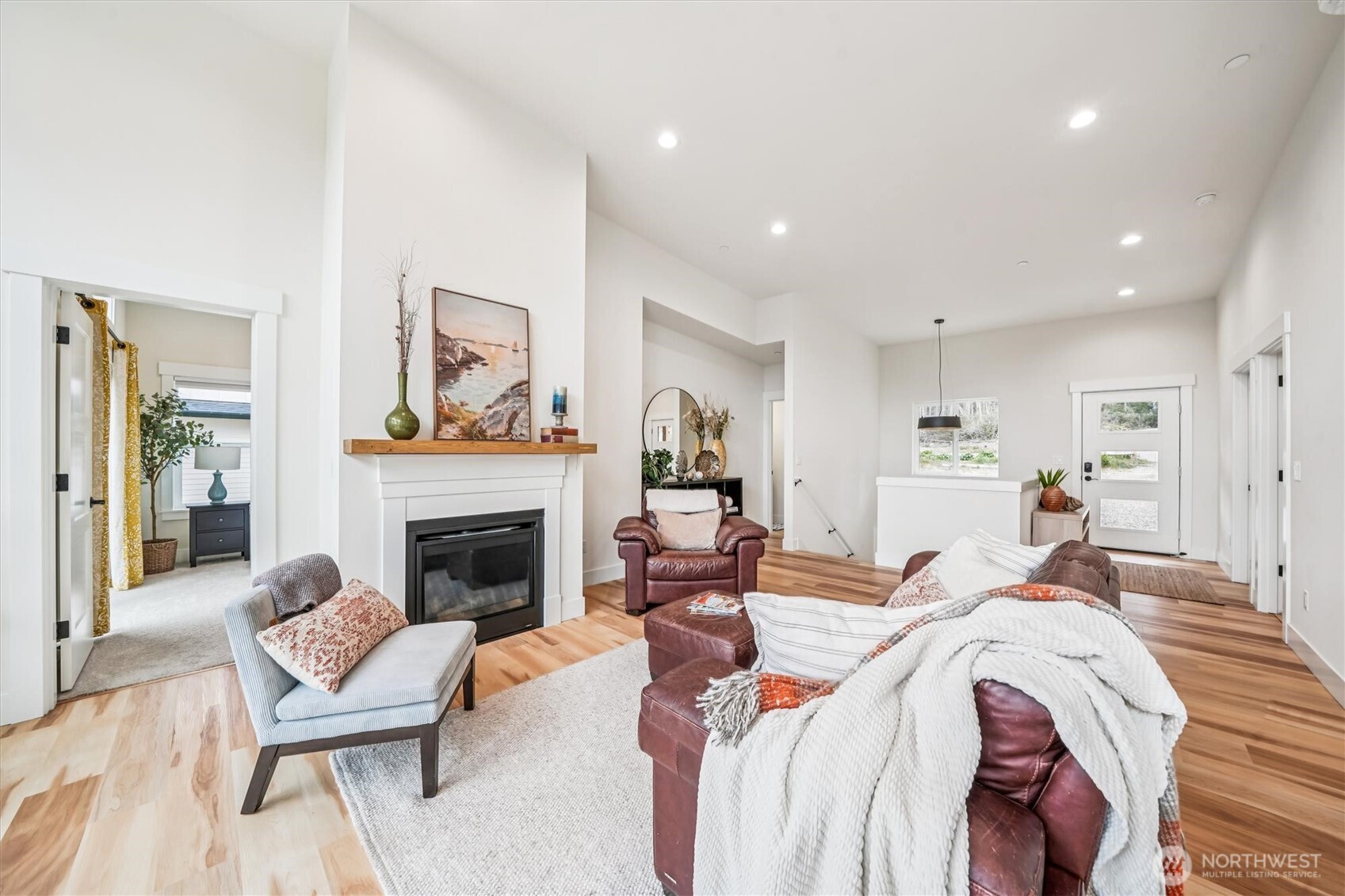 9705 117th Avenue Anderson Island, WA 98303 - Photo 13 of 40 a living room with furniture or fireplace and a fireplace