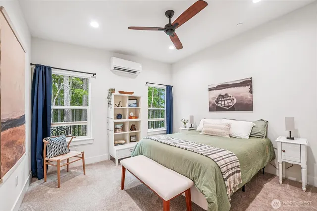 a bedroom with a large bed and a window