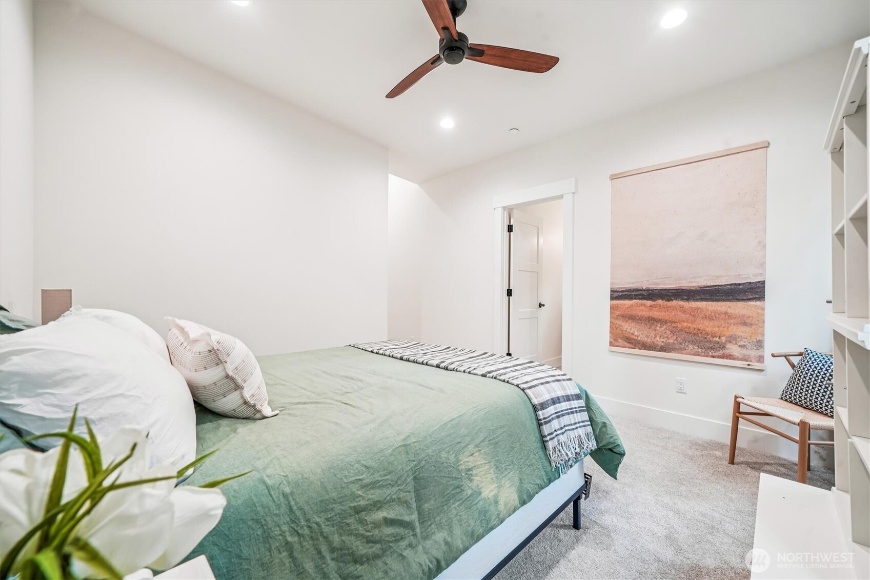 9705 117th Avenue Anderson Island, WA 98303 - Photo 24 of 40 a bedroom with a bed window and couch
