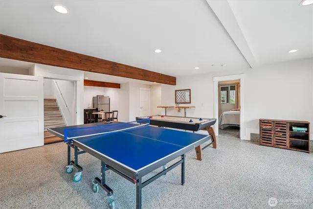 a room with furniture and pool table