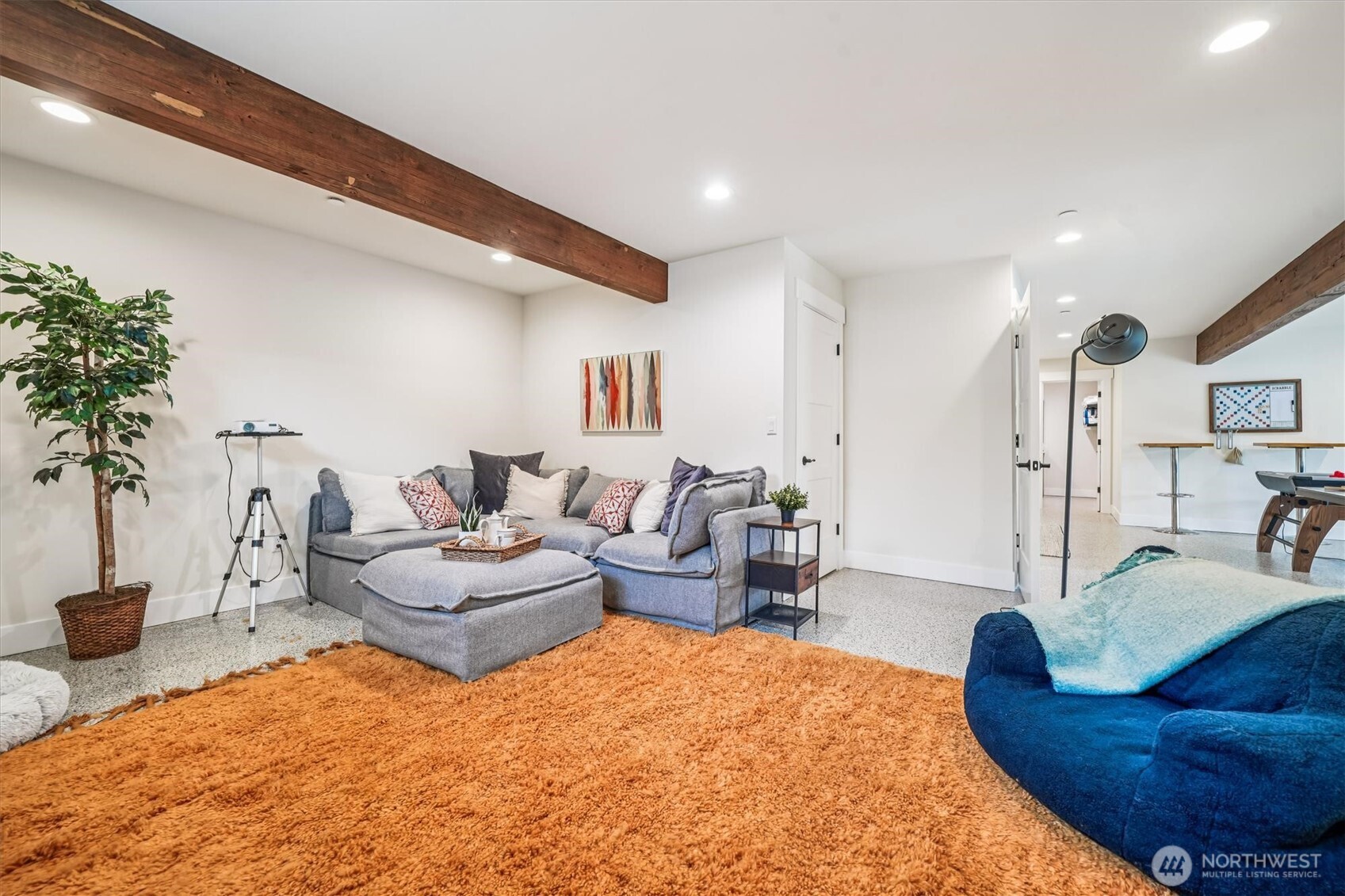 9705 117th Avenue Anderson Island, WA 98303 - Photo 30 of 40 a living room with furniture and a table