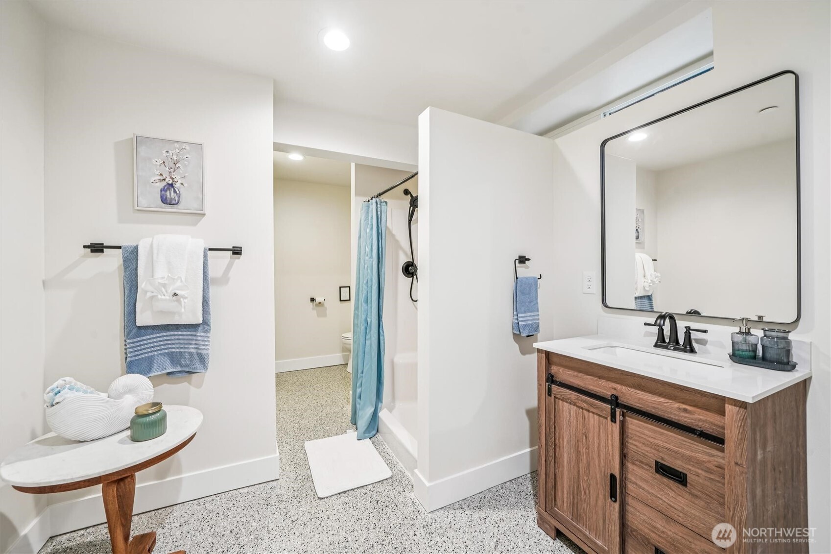 9705 117th Avenue Anderson Island, WA 98303 - Photo 34 of 40 a bathroom with a sink and a mirror