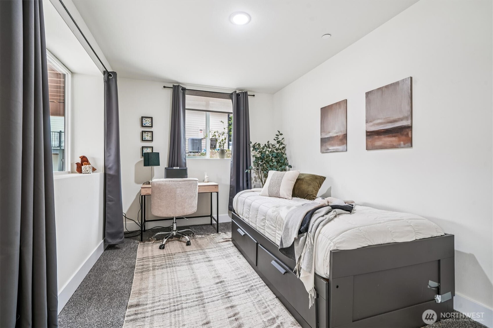 9705 117th Avenue Anderson Island, WA 98303 - Photo 35 of 40 a bedroom with a bed and a large window