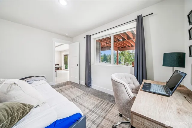 a living room with furniture a window and a table