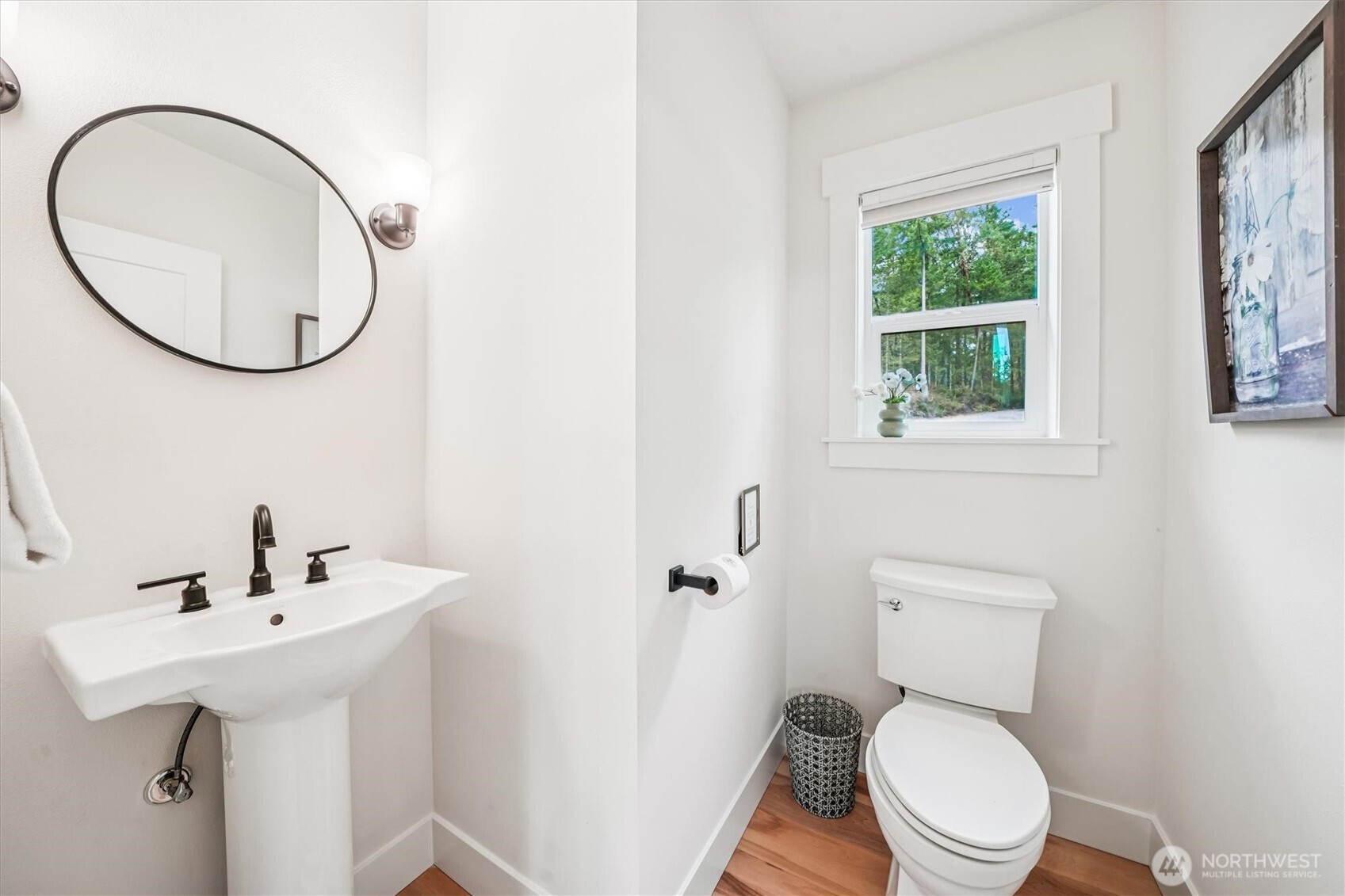 9705 117th Avenue Anderson Island, WA 98303 - Photo 38 of 40 a white toilet sitting next to a bathroom sink