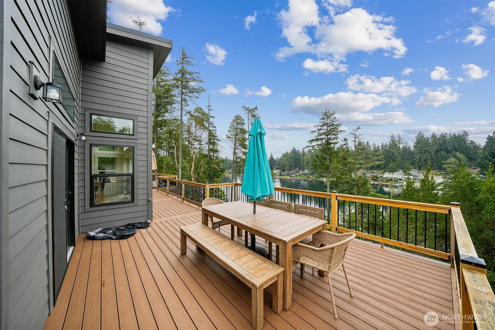 9705 117th Avenue Anderson Island, WA 98303 - Photo 5 of 40 a view of a roof deck with wooden floor and fence
