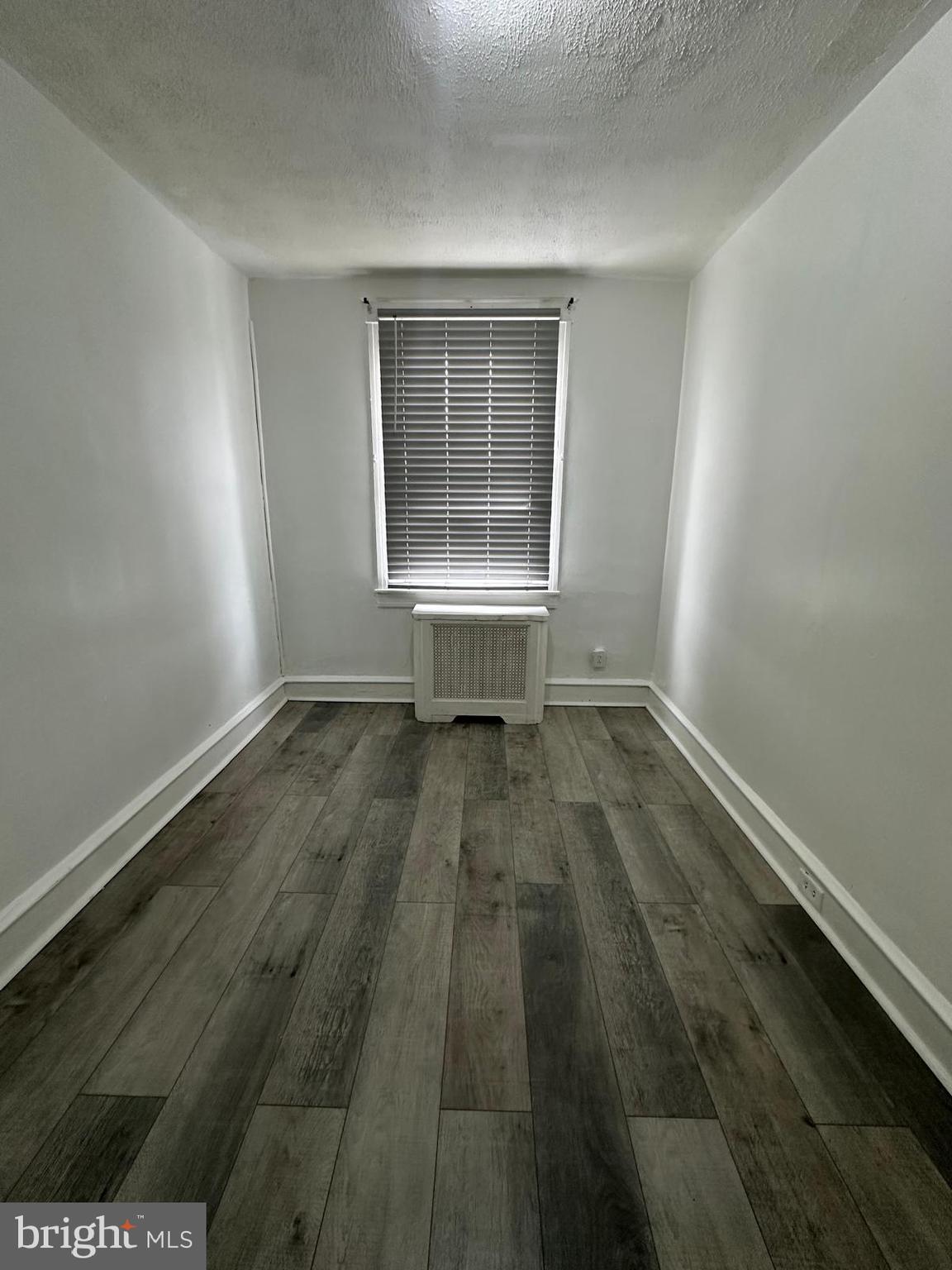 2114 Simon Street Philadelphia, PA 19124 - Photo 12 of 19 an empty room with wooden floor and windows