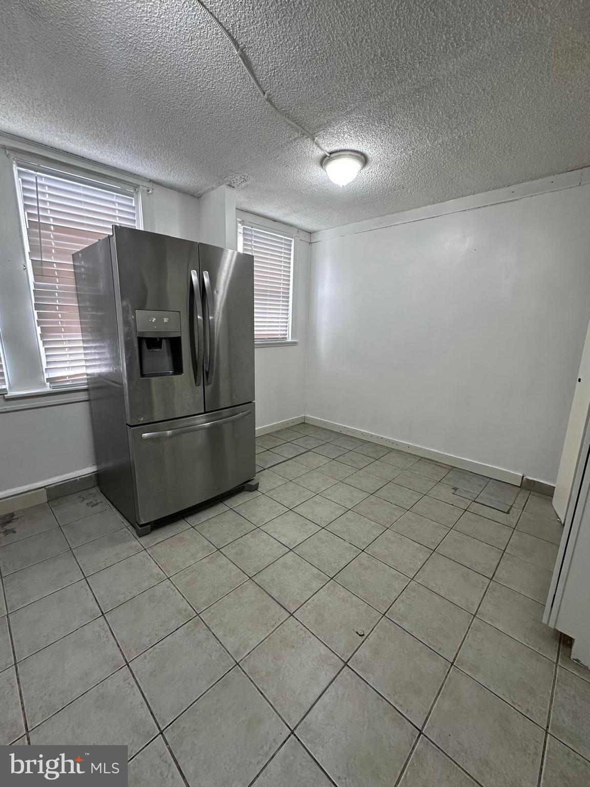 2114 Simon Street Philadelphia, PA 19124 - Photo 5 of 19 a kitchen with a refrigerator and window