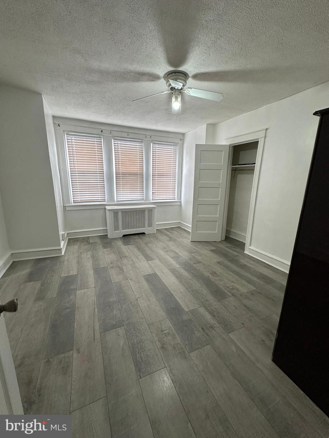 2114 Simon Street Philadelphia, PA 19124 - Photo 7 of 19 wooden floor in an empty room with a window