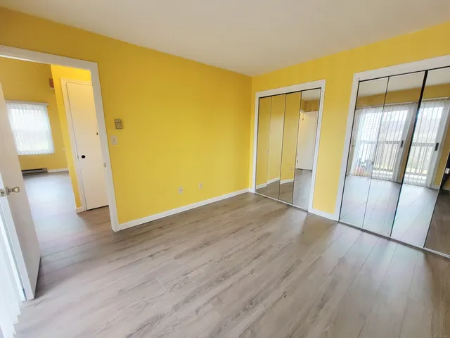 a view of a mountain in the distance in a field