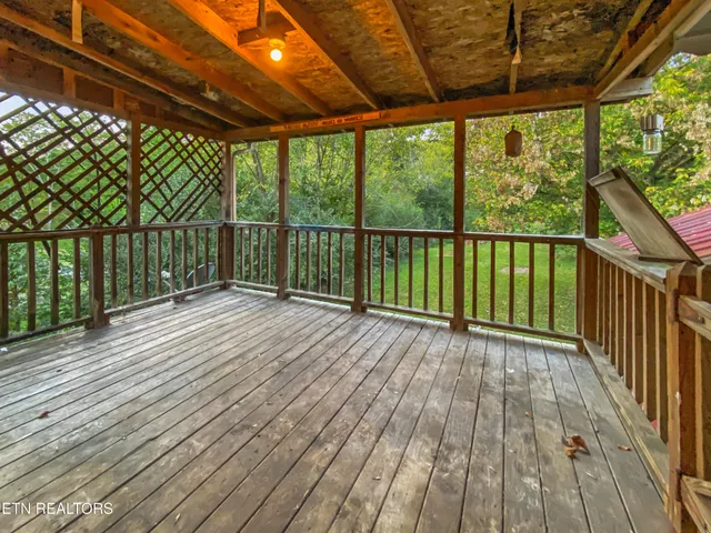 a view of balcony with wooden floor
