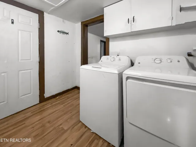 a view of storage and utility room with washer and dryer
