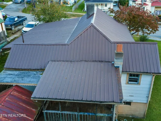 a aerial view of a house with a yard