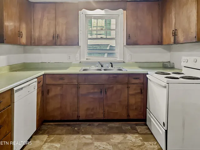 a kitchen with a cabinets and window