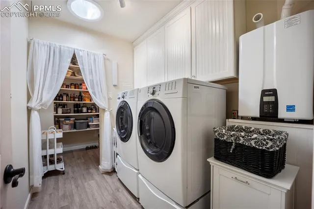 a kitchen with a stove and white cabinets