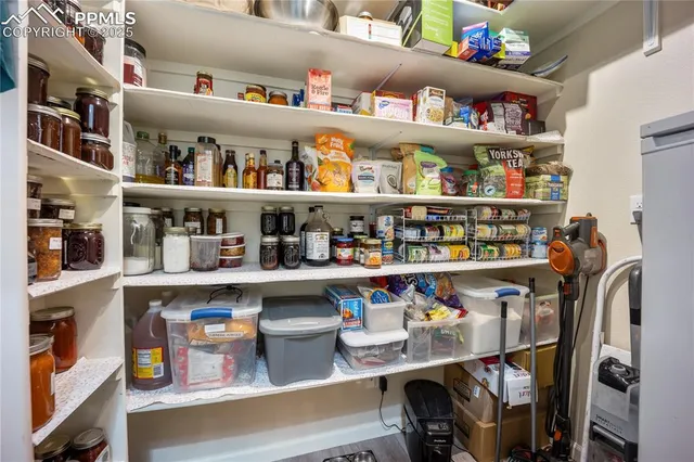 a shelf with cup and plates