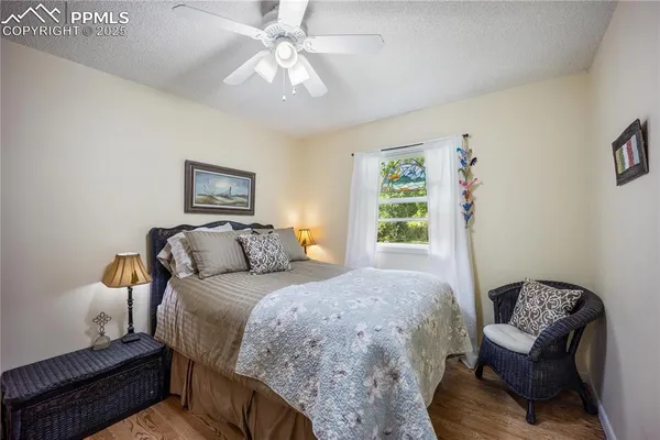 a bedroom with a bed and a chair