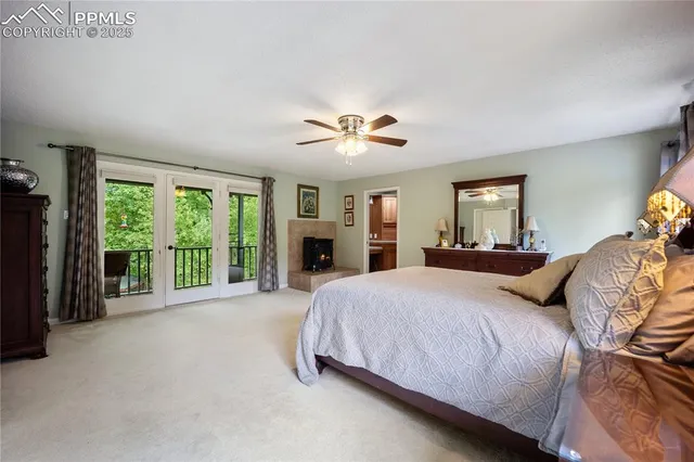 a bedroom with a large bed and a large window