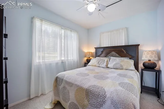 a bathroom with a double vanity sink mirror and toilet