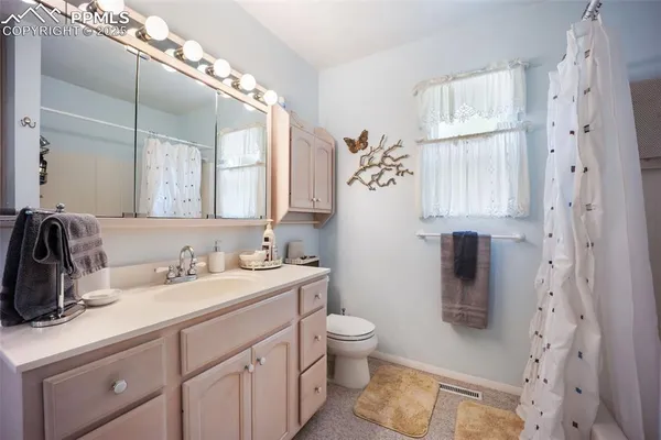 a bedroom with a bed and a table in it
