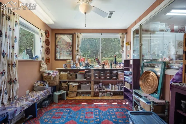 a bathroom with a toilet sink vanity and mirror
