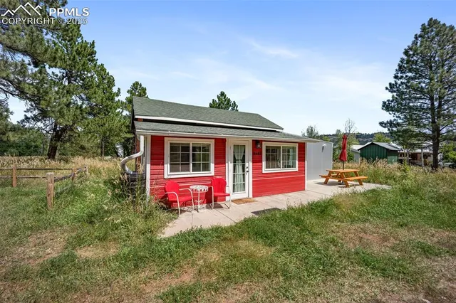a bathroom with a toilet sink shower and mirror
