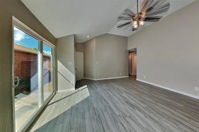 a view of a livingroom with wooden floor